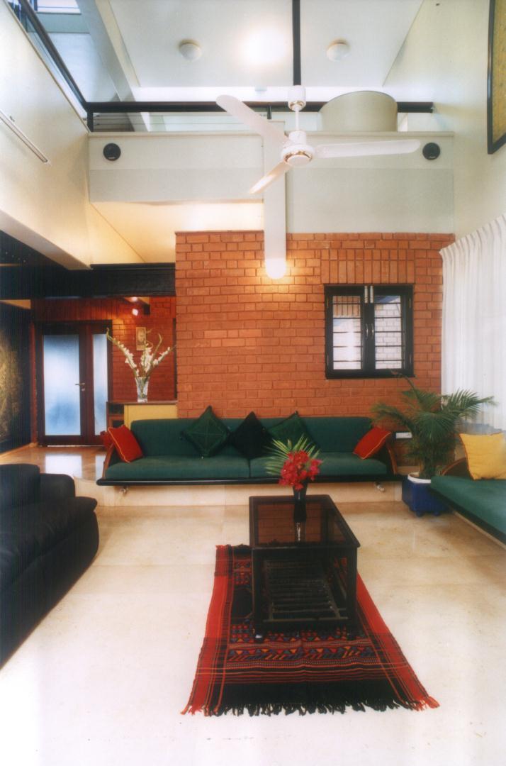Double height living room with built in furniture