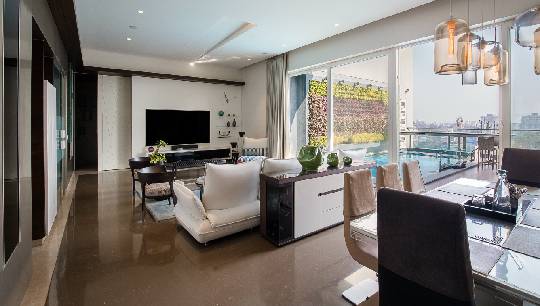 Family living overlooking splash pool