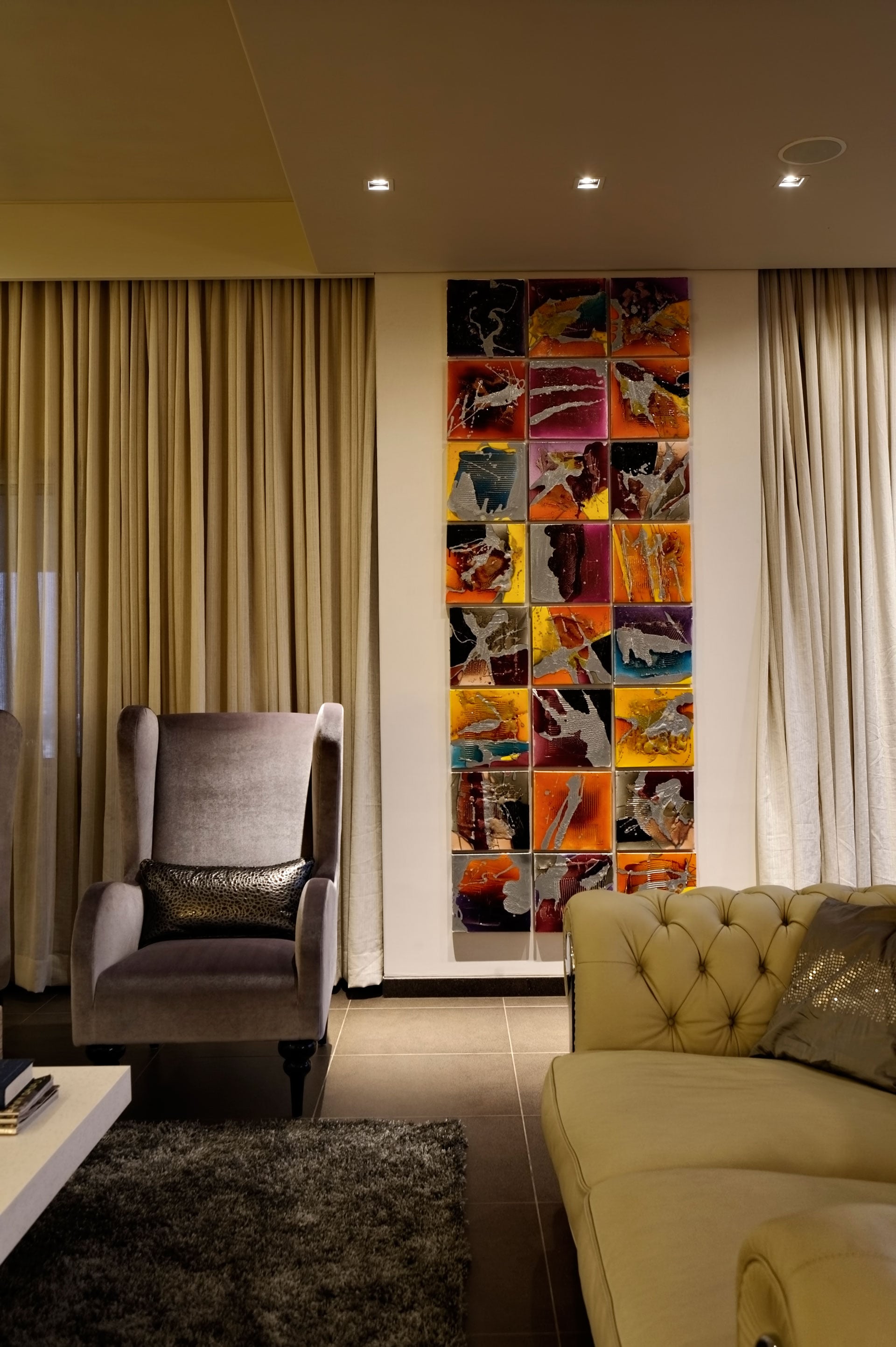 Artworks add a splash of colour to minimalistic monochrome interiors