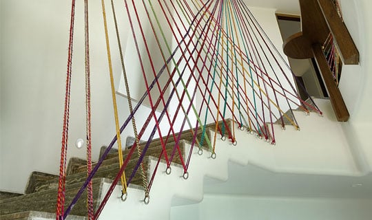 Rajasthani camel wool dhaga as railin an artistic feature in the stairwell