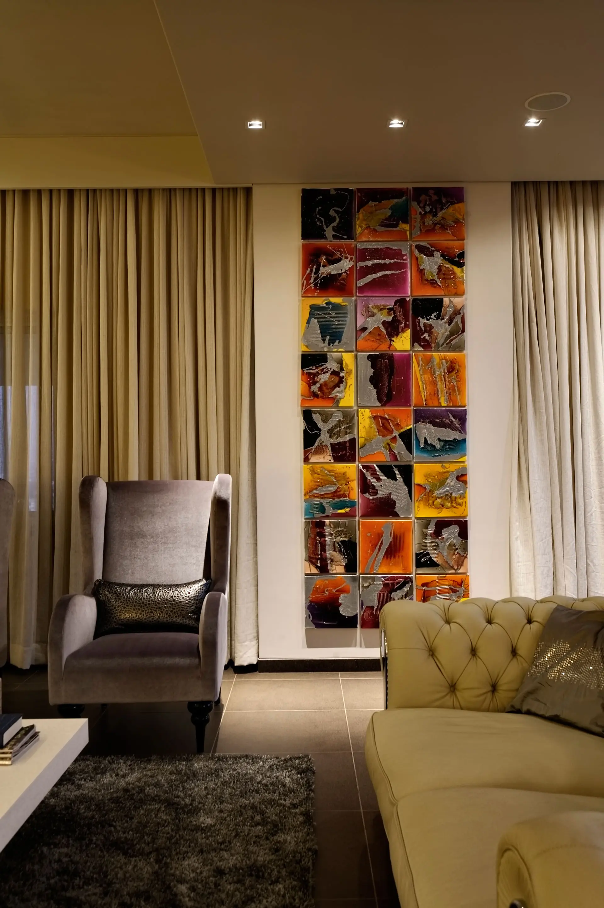 Artworks add a splash of colour to minimalistic monochrome interiors