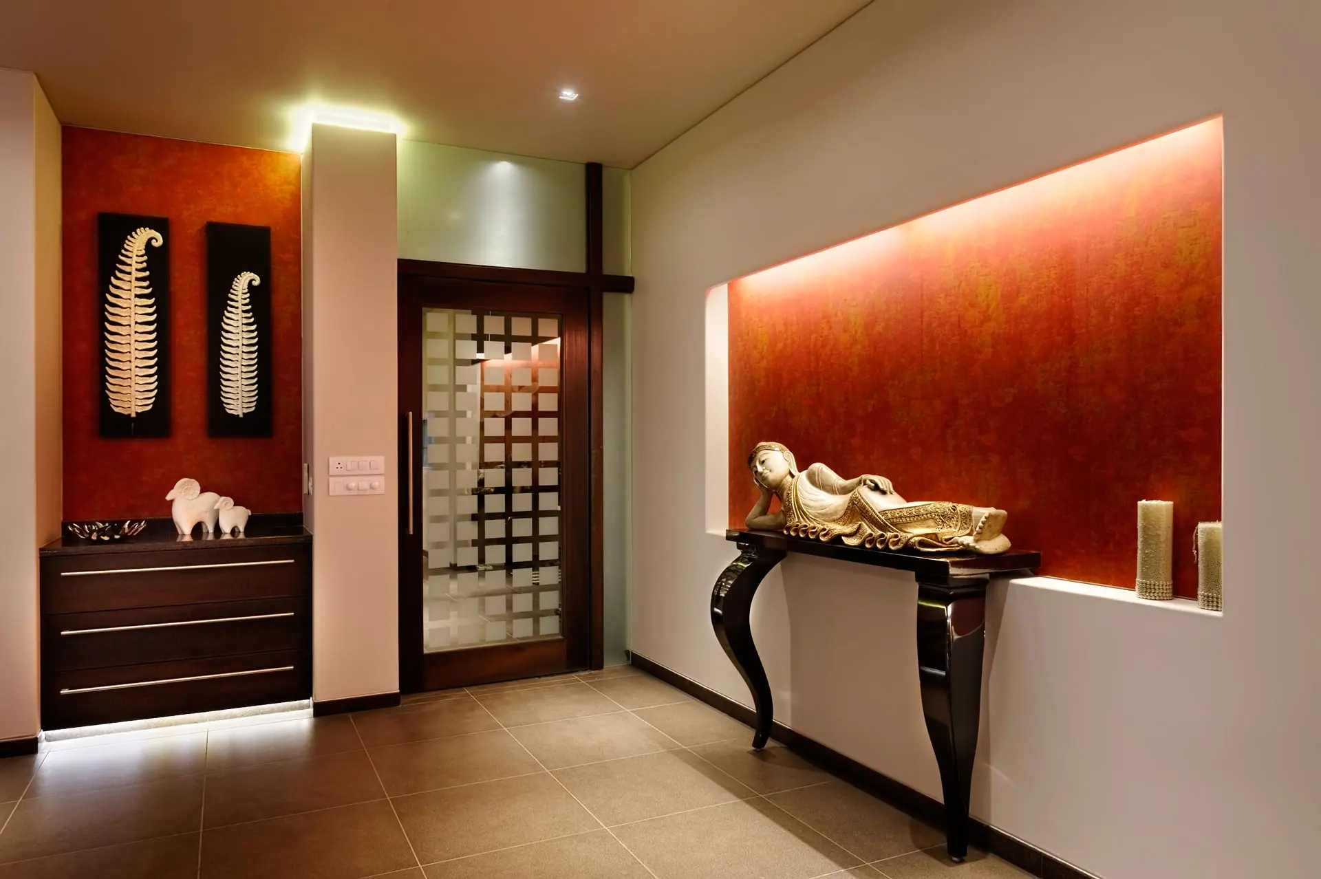 A reclining Buddha Artifact adds a sense of serenity to the dining room