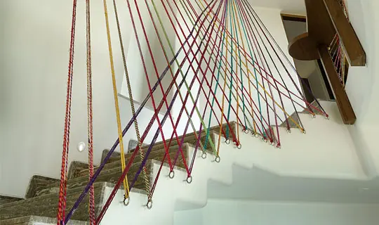 Rajasthani camel wool dhaga as railin an artistic feature in the stairwell